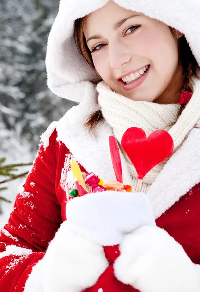 Woman decorating a christmas tree — Stock Photo, Image