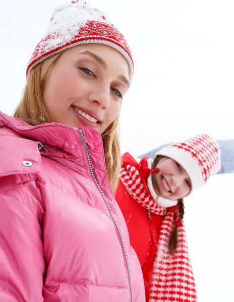 Two young women in winter outdoors Stock Photo