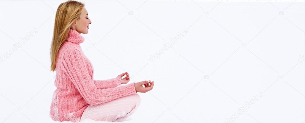 Yoga position in a frozen lake