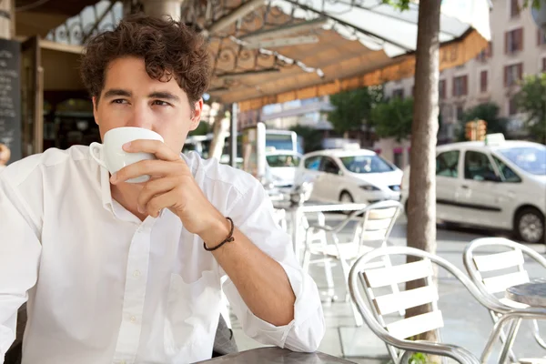 Young businessman having  coffee