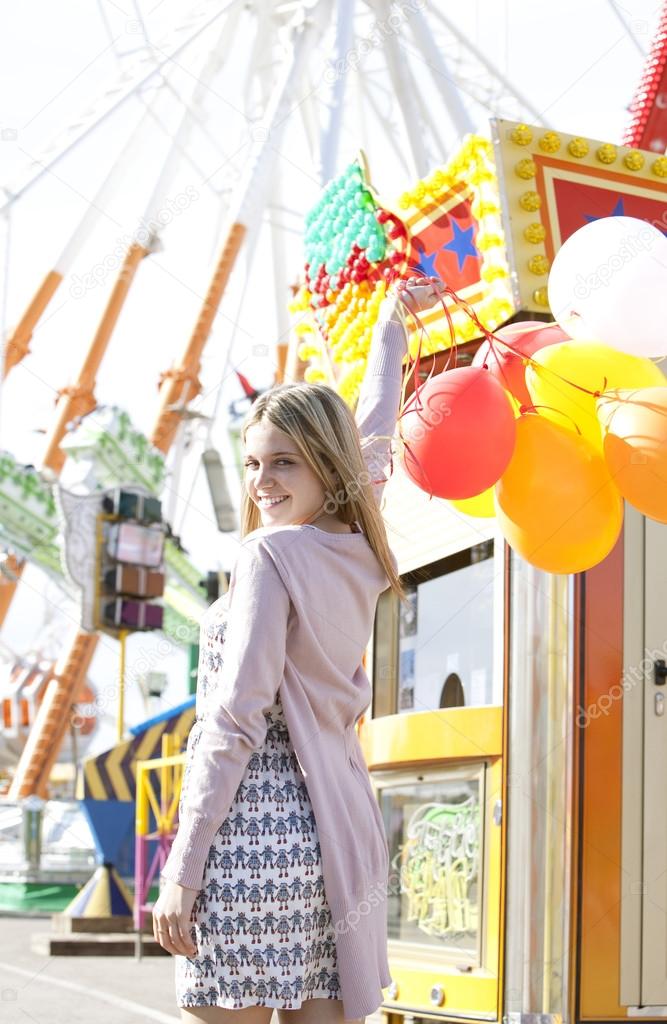 Teenage girl in an amusement park