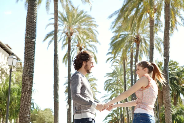 Couple in  palm trees boulevard — Stock Photo, Image