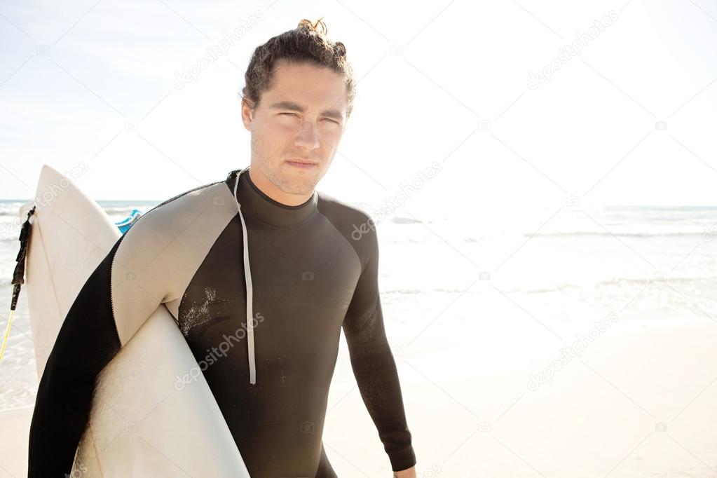 Surfer holding his  board