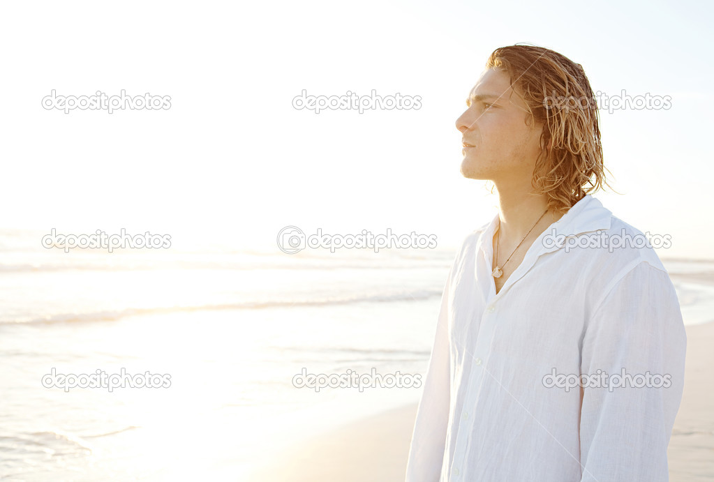 Young man standing on  beach