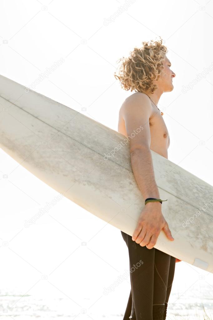 Surfer  standing on a beach