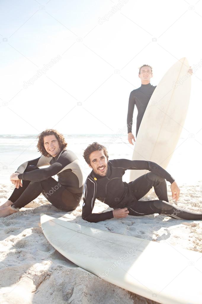 Three friends surfers men Stock Photo by ©mjth 45812489