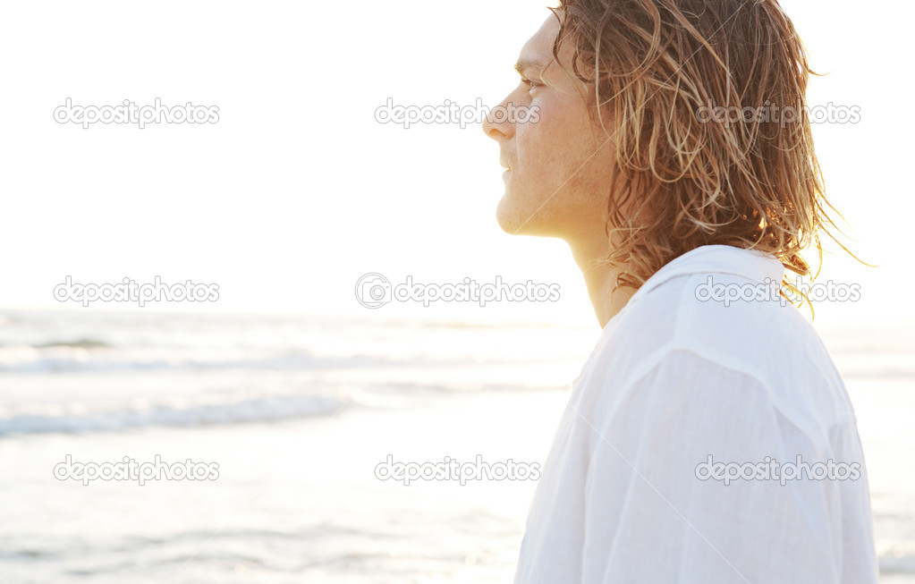 Young man standing on  beach