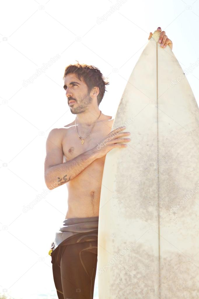 Surfer  standing on a beach