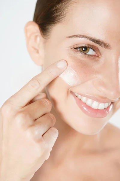 Woman applying care cream — Stock Photo, Image