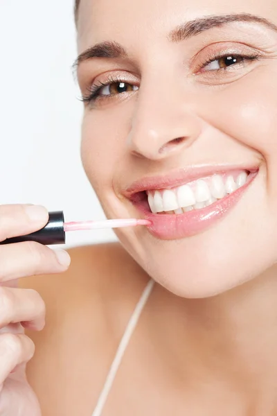Woman applying pink  lipstick — Stock Photo, Image