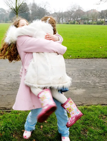 Older sister carrying — Stock Photo, Image