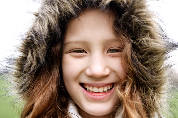 Girl child wearing a warm coat Royalty Free Stock Photos