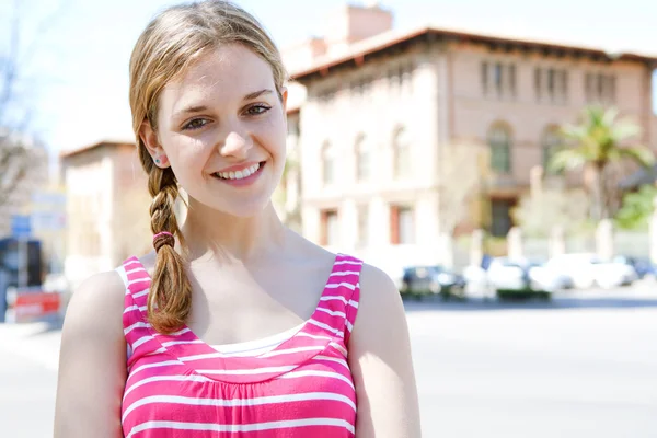 Girl standing near college — Stock Photo, Image