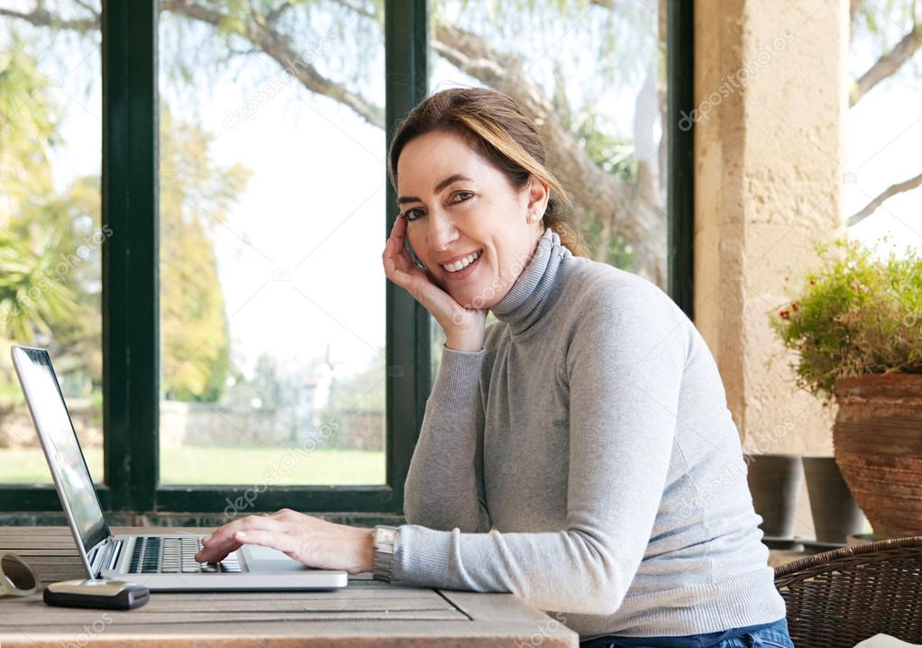 Woman typing on  laptop