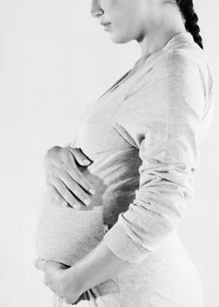 Pregnant woman wearing a cotton bathroom robe — Stock Photo, Image