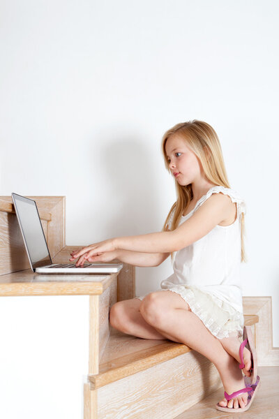 Girl using a laptop computer