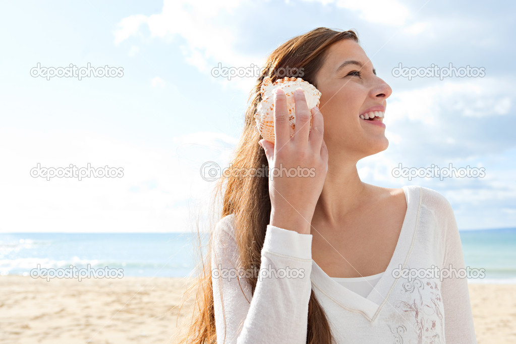 Woman holding a sea shell