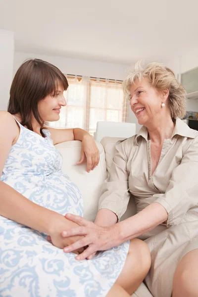 Pregnant mother and grand mother — Stock Photo, Image