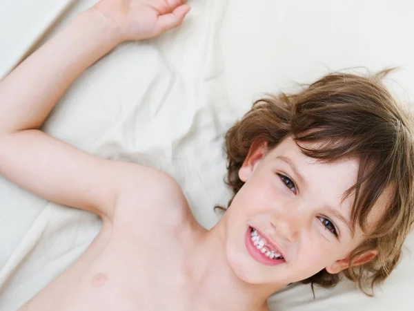 Young boy laying down — Stock Photo, Image