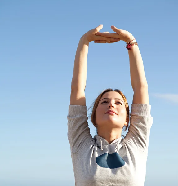 Woman stretching her arms — Stock Photo, Image