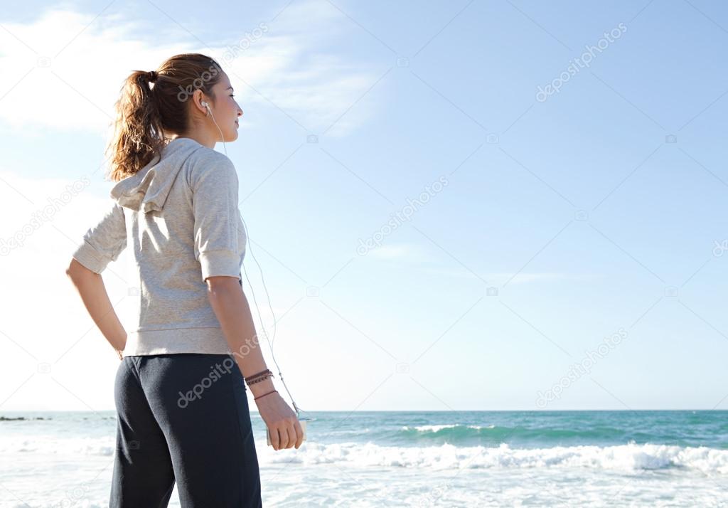 Woman standing on the beach