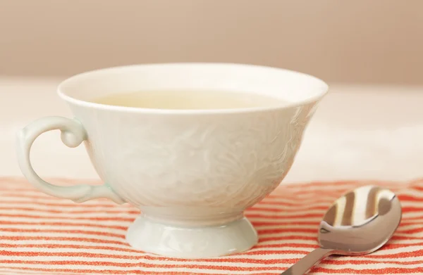 Tea cup and sourcer on a kitchen — Stock Photo, Image