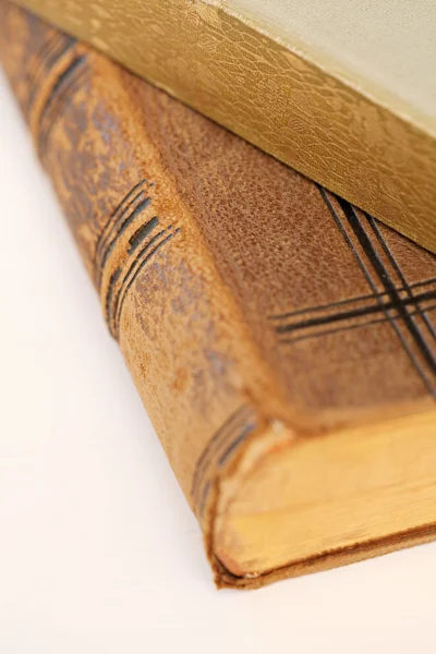 Books resting on a white desk. — Stok fotoğraf