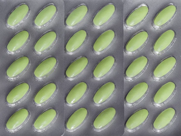 Green pills color in blister pack — Stock Photo, Image