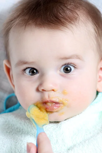 Baby boy eating — Stock Photo, Image