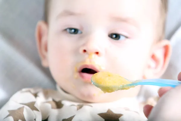 Baby boy eating — Stock Photo, Image