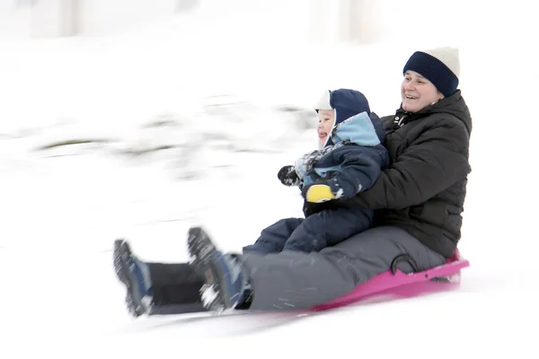 Mother with son on bobsleigh — Stock Photo, Image