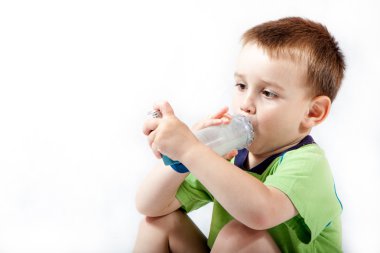 Little boy using inhaler for asthma isolated on white background clipart