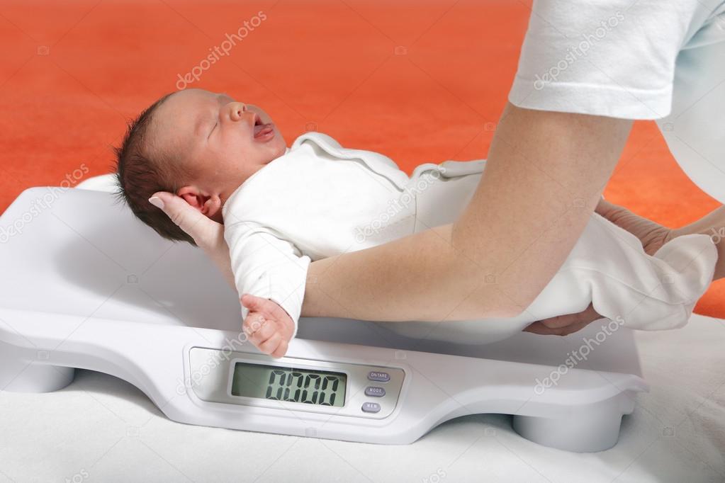 Baby boy on weight scale