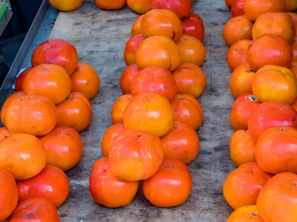 Fresh organic persimmons on the market place
