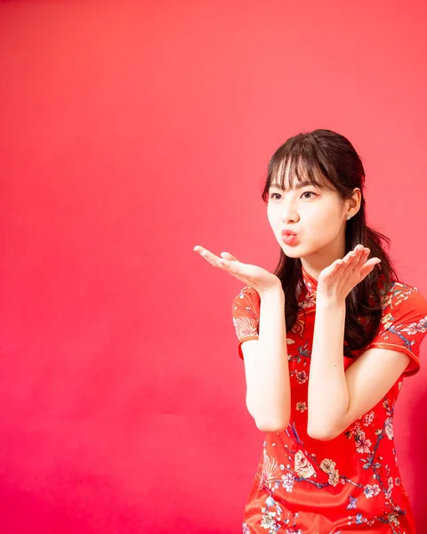 Portrait Young Asian Woman Dressing Cheongsam Blowing Kiss Isolated Red — Zdjęcie stockowe