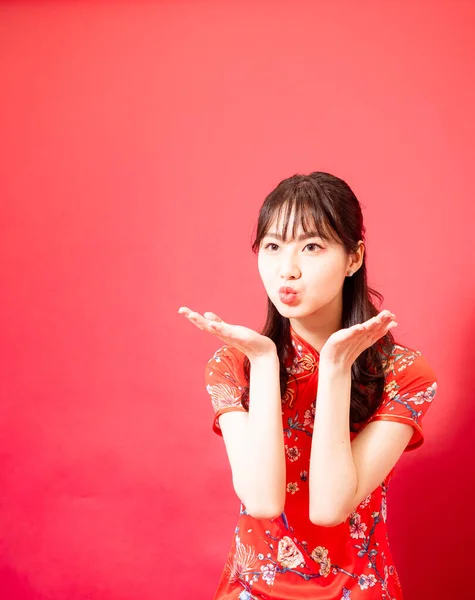 Portrait Young Asian Woman Dressing Cheongsam Blowing Kiss Isolated Red — Stockfoto