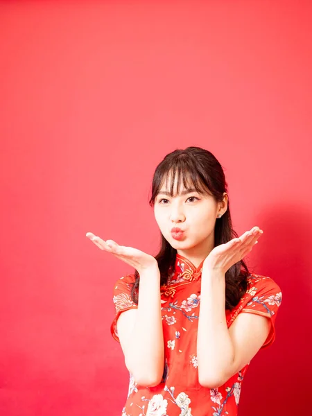 Portrait Young Asian Woman Dressing Cheongsam Blowing Kiss Isolated Red — Stockfoto