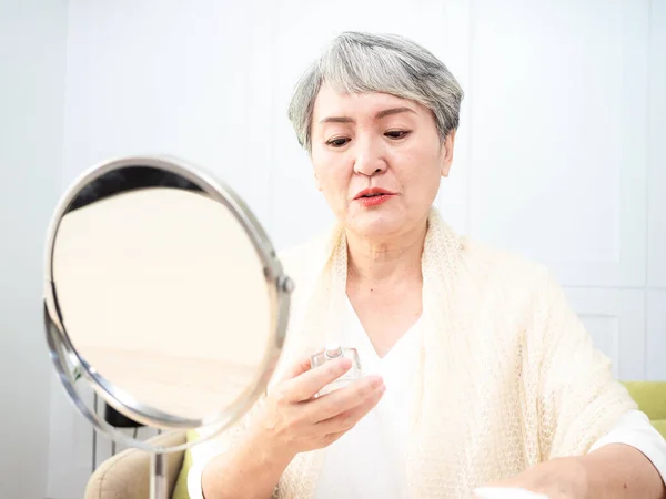 Portrait Mature Aged Asian Woman 60S Sprays Perfume — Fotografia de Stock