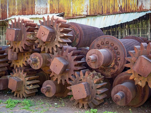 the old and rusty diesel engine gears are abandoned