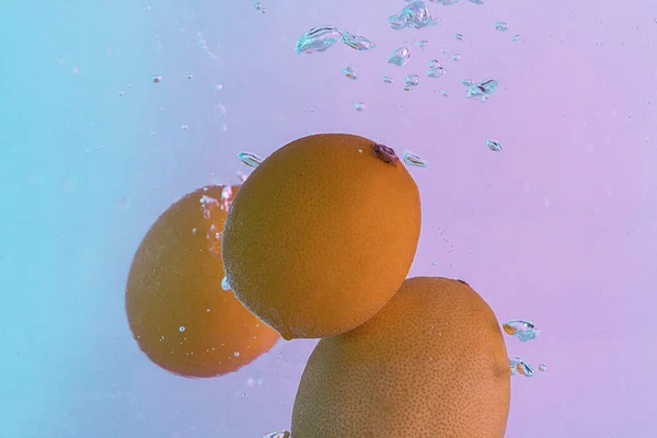 Lemons Fall Water Background Gradient Pink Blue Light — Fotografia de Stock