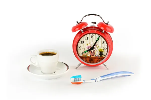 Reloj despertador rojo, café y cepillo de dientes —  Fotos de Stock