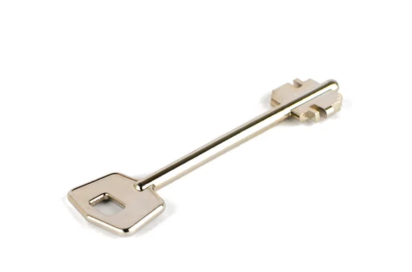 Один длинный металлический ключ — стоковое фото