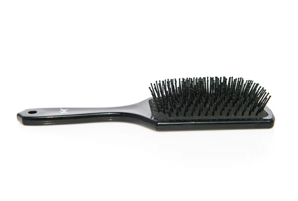 Black hairbrush over isolated background — Stock Photo, Image