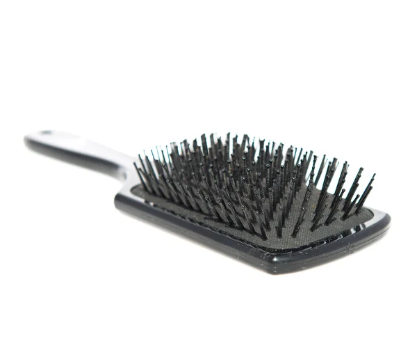 Black hairbrush over isolated background — Stock Photo, Image
