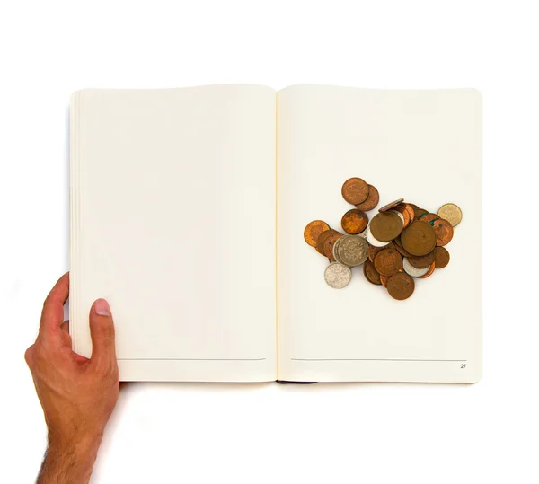 Kupie monety drukowane na białą księgę. — Zdjęcie stockowe