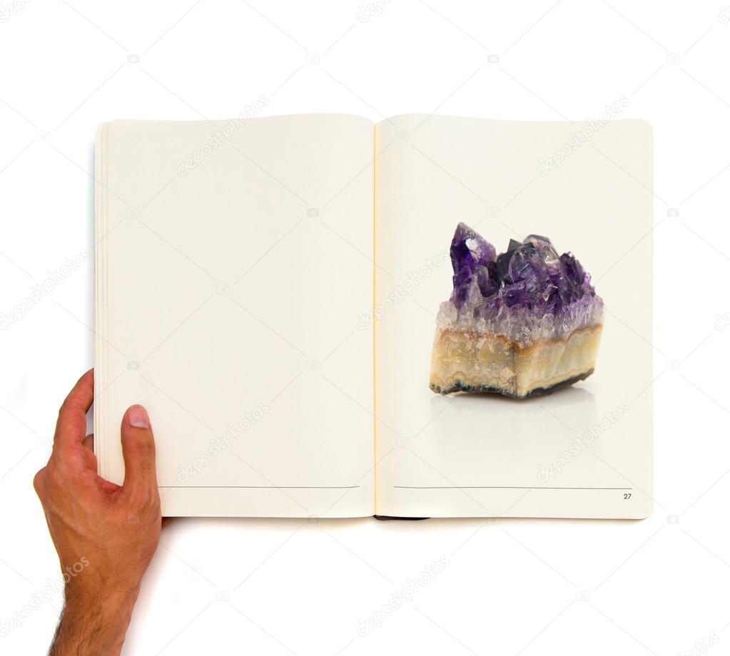 single quartz printed on white book.