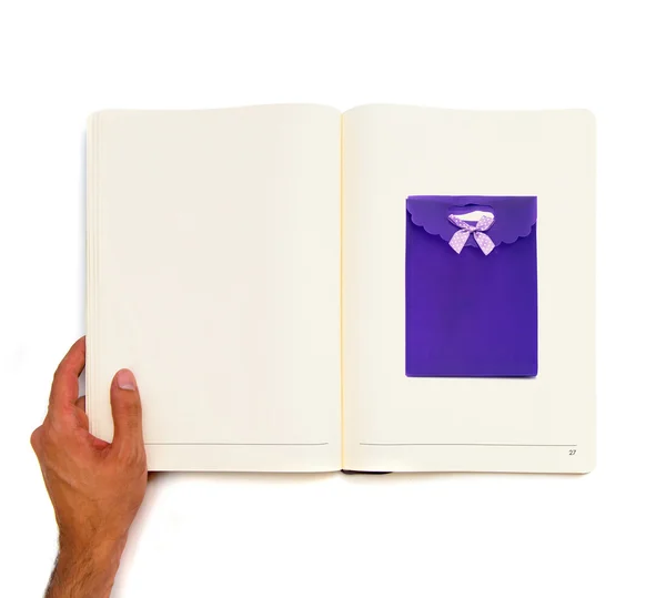 Saco azul fechado impresso em livro branco — Fotografia de Stock