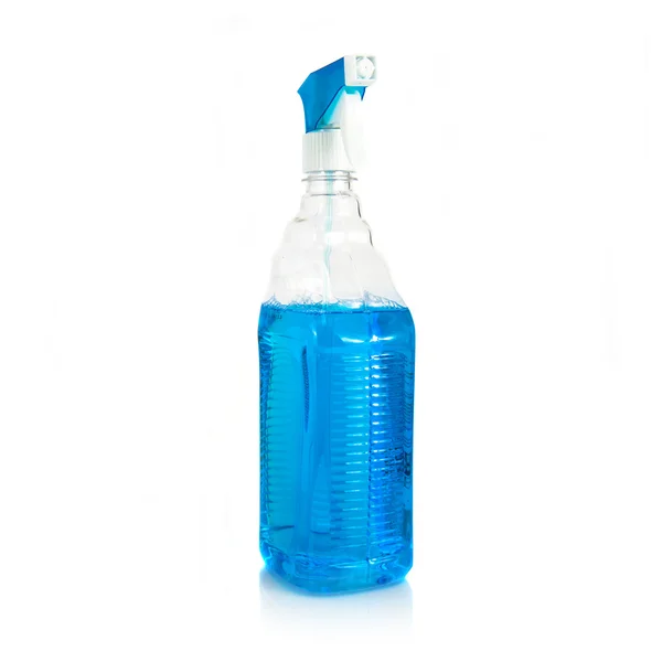 Glass cleaner with blue liquid inside over white background — Stock Photo, Image