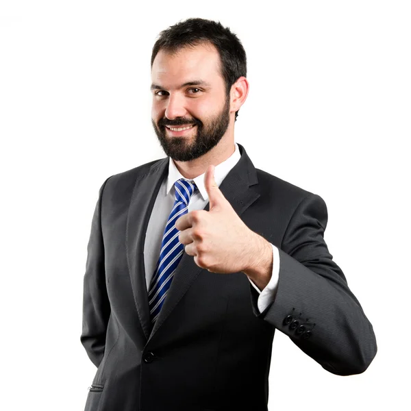 Joven hombre de negocios recibiendo OK sobre fondo blanco —  Fotos de Stock