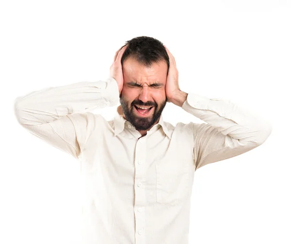 Young man with headache over white background — Stock Photo, Image